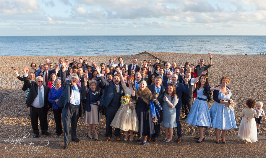 wedding guests group photo on beach